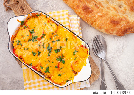Madame Bovary's Georgian dish, chicken fillet with mushrooms, tomatoes and cheese, baked in a mold, 131078978