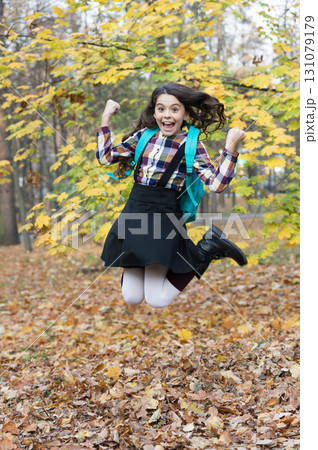 Autumn time to study. Knowledge and education. School education. Student life. Back to school. Autumn girl with school bag. Education for adolescence. Teen girl in autumn park outdoor. Graduated 131079179