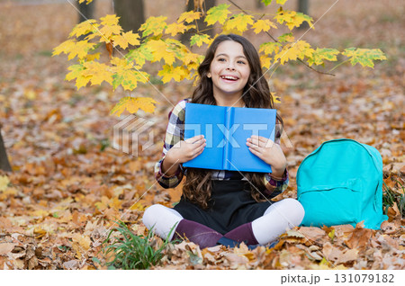 School education. School girl reading book outdoor. Teen girl reading in the autumn park. Education and knowledge. Knowledge day. Self education. Autumn book. Back to school. Happy childhood School education. School girl reading book outdoor. Teen girl reading in the autumn park. Education and knowledge. Knowledge day. Self education. Autumn book. Back to school. Happy childhood 131079182