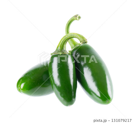 Fresh jalapeno pepper isolated on white background. Slices of green hot serrano pepper. Clipping path. Fresh jalapeno pepper isolated on white background. Slices of green hot serrano pepper. Clipping path. 131079217