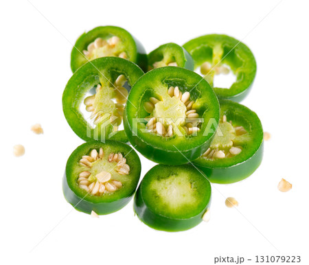 Fresh jalapeno pepper isolated on white background. Slices of green hot serrano pepper. Clipping path. Fresh jalapeno pepper isolated on white background. Slices of green hot serrano pepper. Clipping path. 131079223