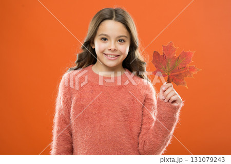 Maple syrup. Little child hold maple leaf. Small girl smiling with maple leaf. Maple syrup is often used as condiment for pancakes waffles oatmeal or porridge. Ingredient in baking and sweetener 131079243