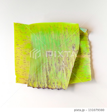 Yellow leaves of banana tree on background. Yellow leaves of banana tree on background. 131079380