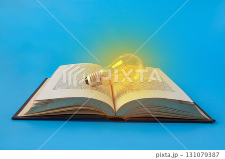 A light bulb on old books , Idea of learning, Education concept. A light bulb on old books , Idea of learning, Education concept. 131079387