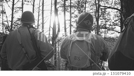 Back View On American Infantry Soldiers standing together At Winter Day. Group Of Usa Soldiers Armed Of Sturmgewehr 44 Or Assault Rifle 44. Usa Army Soldiers Of World War Ii 131079410
