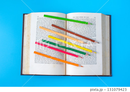 Bright color pencils on old books. Bright color pencils on old books. 131079423