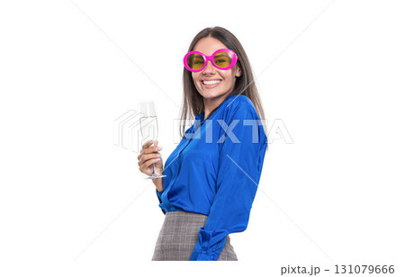 Businesswoman have fun in corporate party. Celebrate especial event. Corporate anniversary party. Business woman celebrating success cheering champagne. Party fun 131079666