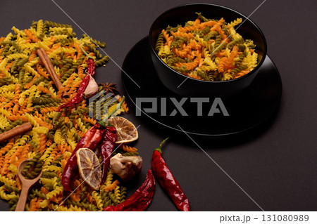 different ingredients for cooking and delicious italian pasta in plate 131080989