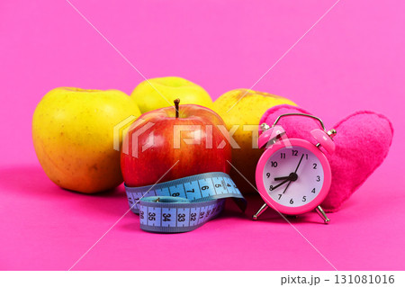 Set of apples in red and yellow colors on tape 131081016