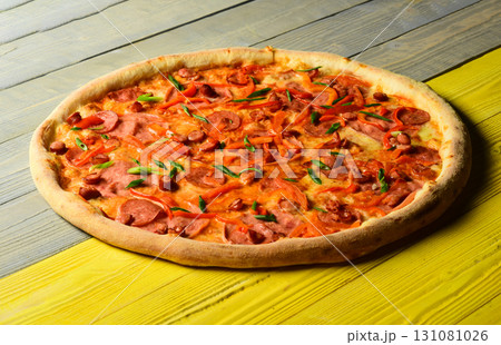 Spicy pizza with pepper and seasoning. American pizza and pizzeria 131081026