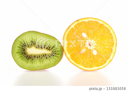 Kiwifruit and orange halves isolated on white background Kiwifruit and orange halves isolated on white background 131081058