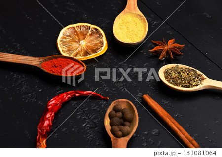 Wooden spoons with paprika, turmeric, herbs and pepper Wooden spoons with paprika, turmeric, herbs and pepper 131081064