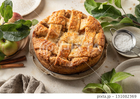 Homemade Apple Pie with fresh apples on textured background. Thanksgiving traditional dessert, autumn baking, recipe 131082369