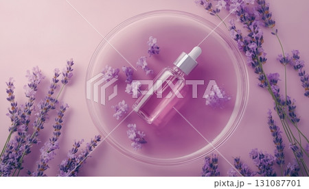 Lavender flower extract and glass bottle liquid in glass plate sample, wellness natural ingredient 131087701