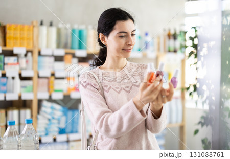 Woman choosing nail polish Woman choosing nail polish 131088761