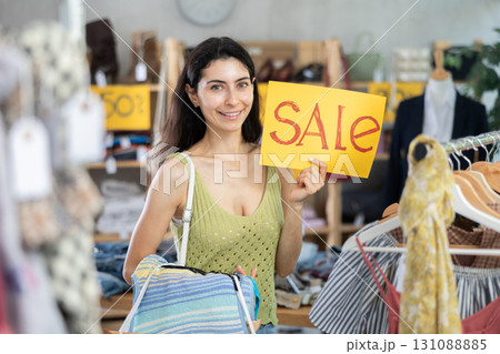 Armenian woman holds a poster with an inscription about the distribution 131088885