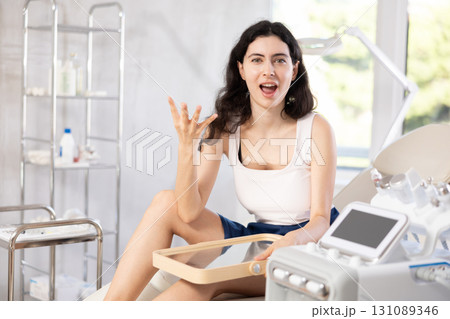woman gazes at herself in mirror woman gazes at herself in mirror 131089346