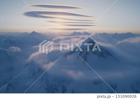 Lenticular Clouds Hovering Above Snow-Capped Mountain Peaks at S Lenticular Clouds Hovering Above Snow-Capped Mountain Peaks at S 131090026