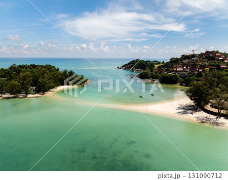 A coastal view featuring a turquoise lagoon and white sandy beach with lush green surroundings. Koh Samui, Thailand. 131090712