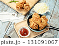 Crispy Fried chicken with tomato sauce on grunge background table. Fast food unhealthy. 131091067