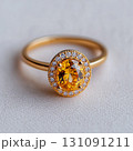Elegant Yellow Diamond Ring with Halo Setting on Soft Background 131091211
