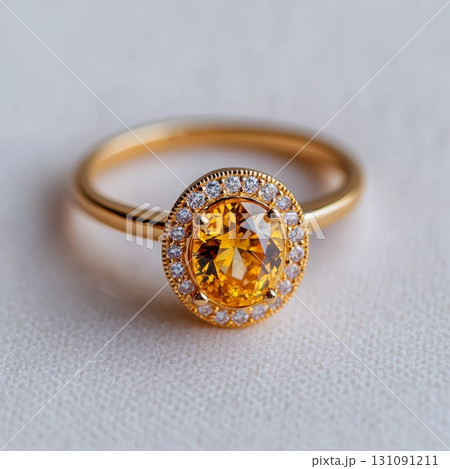 Elegant Yellow Diamond Ring with Halo Setting on Soft Background Elegant Yellow Diamond Ring with Halo Setting on Soft Background 131091211