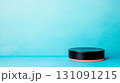 Glossy Round Podium on Blue Background Ideal for Presentations and Exhibitions 131091215