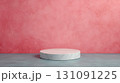 Luxury Round Podium with Polished Surface against Pink Textured Background 131091225