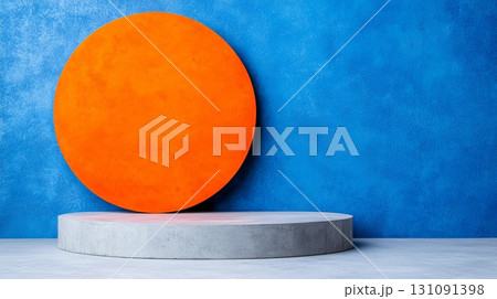 Vibrant Round Podium Against Blue Wall with Bold Orange Circular Design Element 131091398