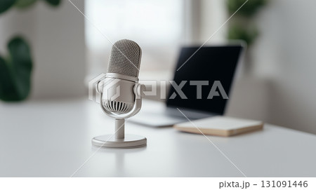 Modern microphone on desk with laptop background for podcast or online work Modern microphone on desk with laptop background for podcast or online work 131091446