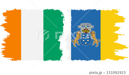 Canary Islands and Ivory Coast grunge flags connection vector 131092923