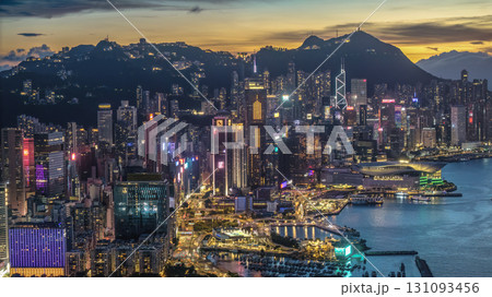 Aug 1 2025 Illuminated Central Skyline Overlooking a Harbor During Dusk 131093456