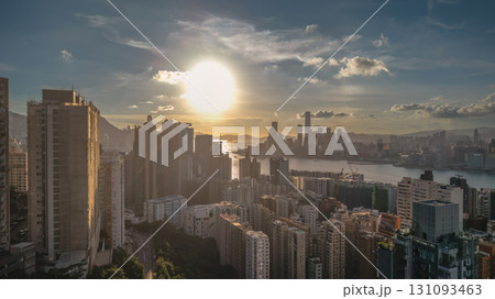 Aug 1 2025 Scenic Cityscape Overlooking a Harbor at Sunset with Urban Silhouettes 131093463