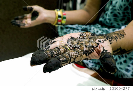 Fresh Mehndi Design on Hands with Intricate Patterns 131094277