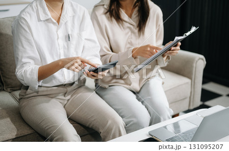Portrait of success business people working together in office. Couple teamwork startup concept on sofa 131095207