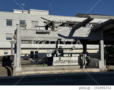 Damaged Structure Featuring Exposed Beams Amidst Surrounding Debris 131095252