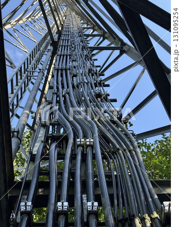 The Intricate and Complex Wiring of a Telecommunications Tower 131095254