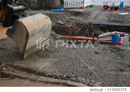 Large construction site with a large shovel digging into the ground Large construction site with a large shovel digging into the ground 131095370