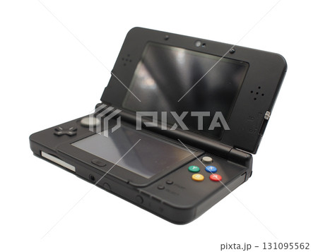 Portable handheld gaming console in black color, opened and isolated on white background. Perfect for concepts of retro gaming 131095562
