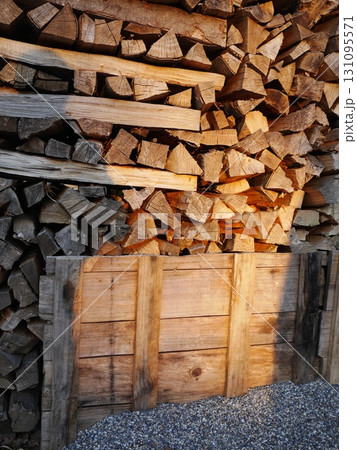 Pile of wood logs stacked on top of each other 131095571