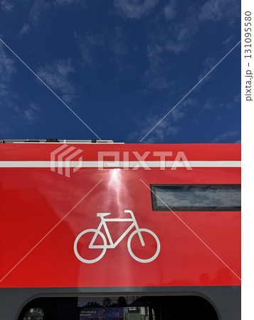 A Bicycle Symbol Portrayed on a Bright Red Background, Emphasizing Activity and Adventure 131095580