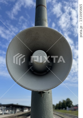 A Street Megaphone is Standing Proudly and Clearly Against a Bright Blue Sky Above Us 131095665