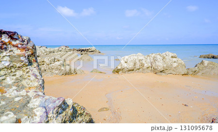 TitleRocky Shore and Sandy Beach on a Sunny Day 131095678