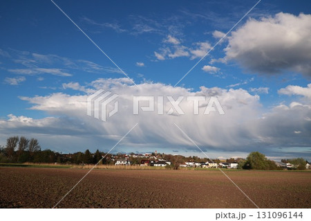 Large cloud in the sky with a blue sky behind it 131096144