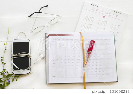 notebook, mobile phone and calendar for planner business work  131098252