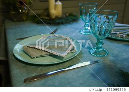 Festive table setting with a napkin on a plate Festive table setting with a napkin on a plate 131099526