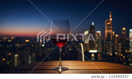 都会の夜景に映える赤ワインのグラス/Red wine glass with city skyline 都会の夜景に映える赤ワインのグラス/Red wine glass with city skyline 131099597
