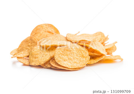 Crispy potato chips isolated on white background. 131099709