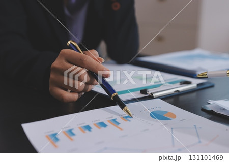 Team of business people working together in the meeting room office,teamwork background charts and graphs banner, double exposure successful teamwork,business planning concept. 131101469