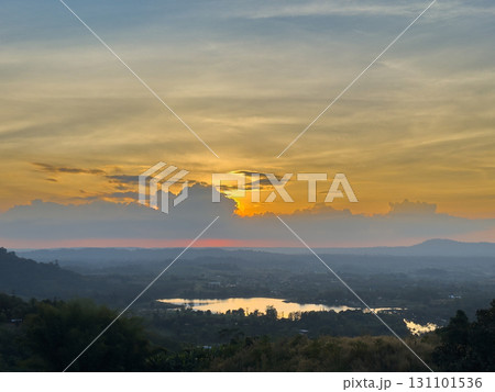 wide view of lake and forest with sunset sky 131101536